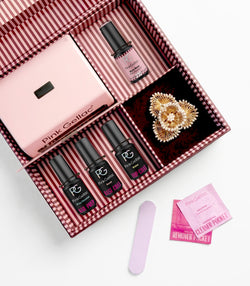 Open Pink Gellac Pretty Pearlesque gift box with gel polishes and accessories.