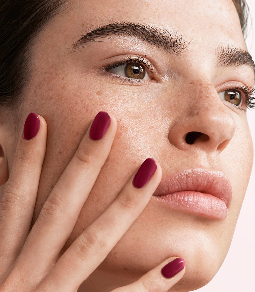 Manicured nails painted with Pink Gellac 491 Cherry Carat gel polish.