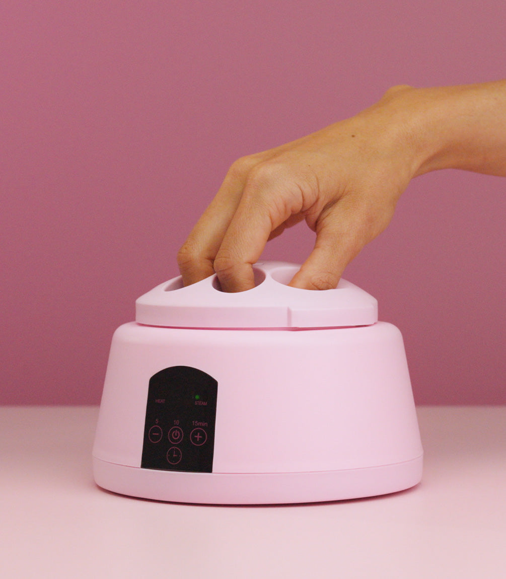A finger placed into the Pink Gellac steam gel removal device.