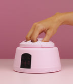 A finger placed into the Pink Gellac steam gel removal device.
