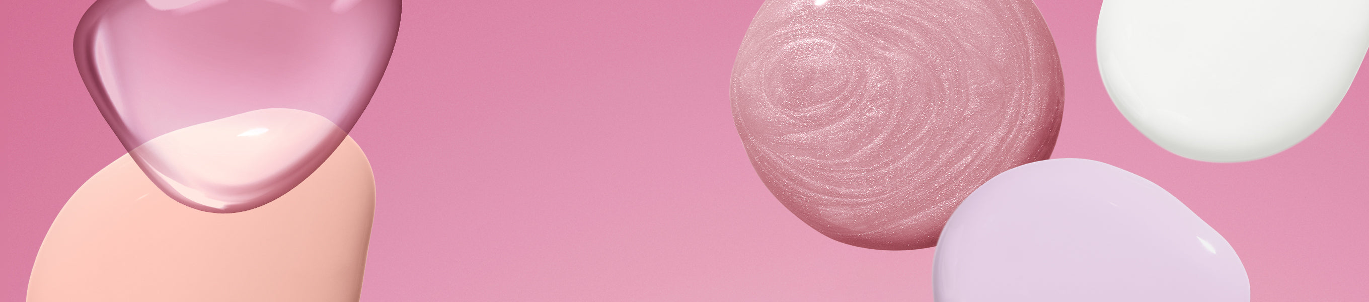 Abstract shapes of different colors and textures against a pink background.