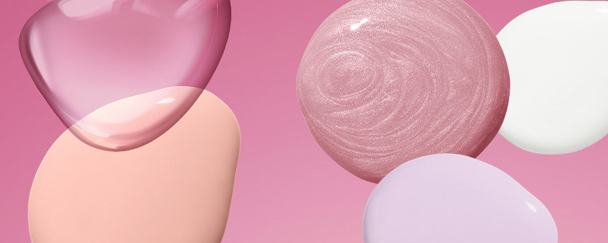Different drops in soft pastel colors on a pink background.