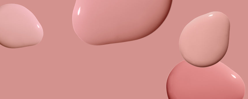 Three pink liquid shapes on a soft pink background.