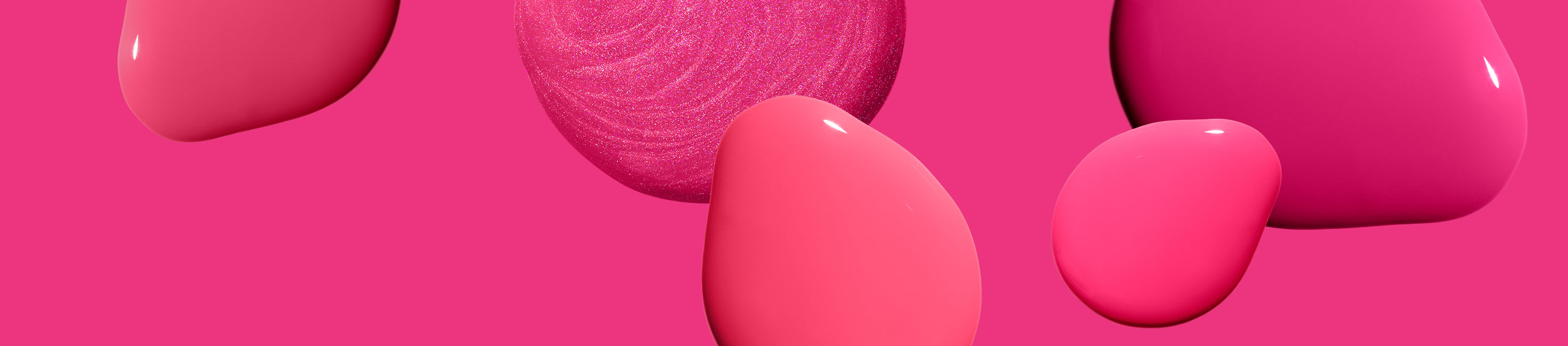 Pink background with different shapes and shades of pink nail polish drops, including one with a shimmering texture.