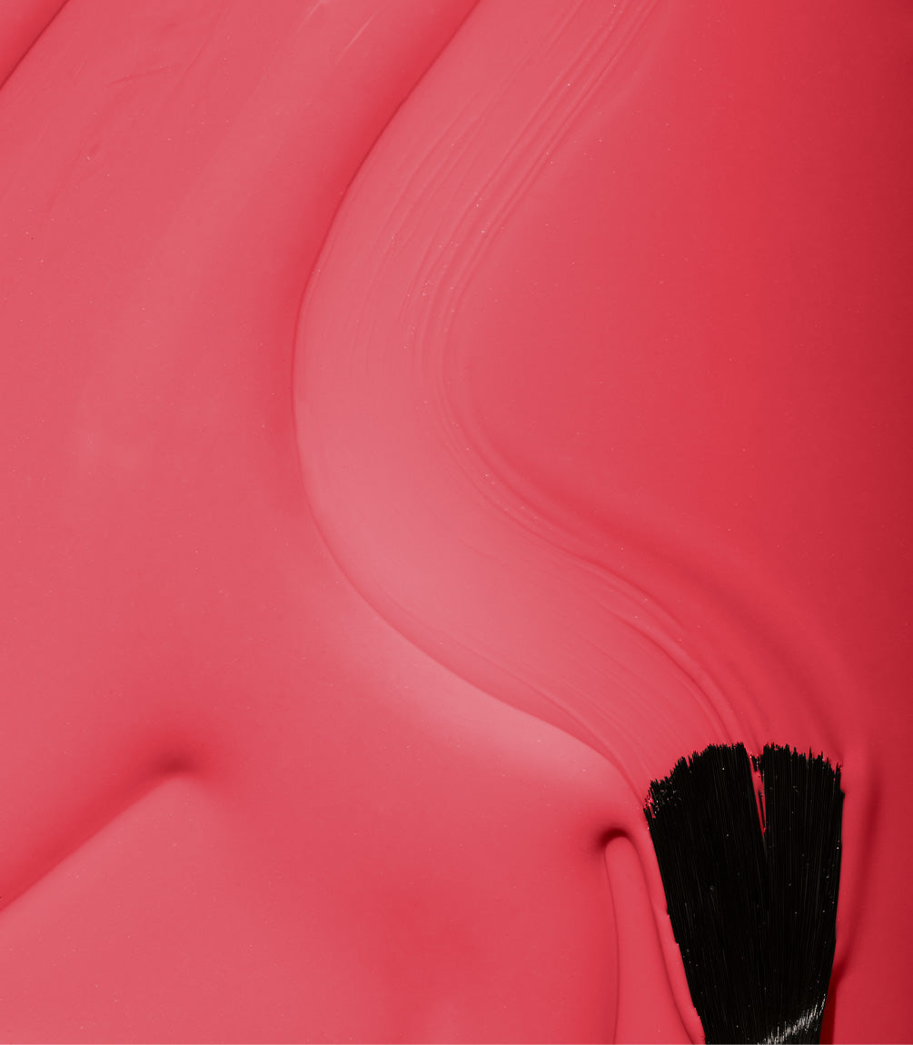 Close-up of Pink Gellac 142 Coral Red gel polish texture.