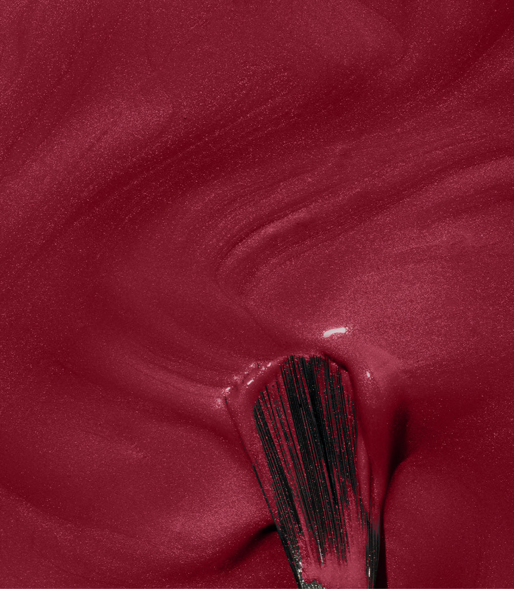 Close-up of Pink Gellac 354 Merlot Red gel polish texture.