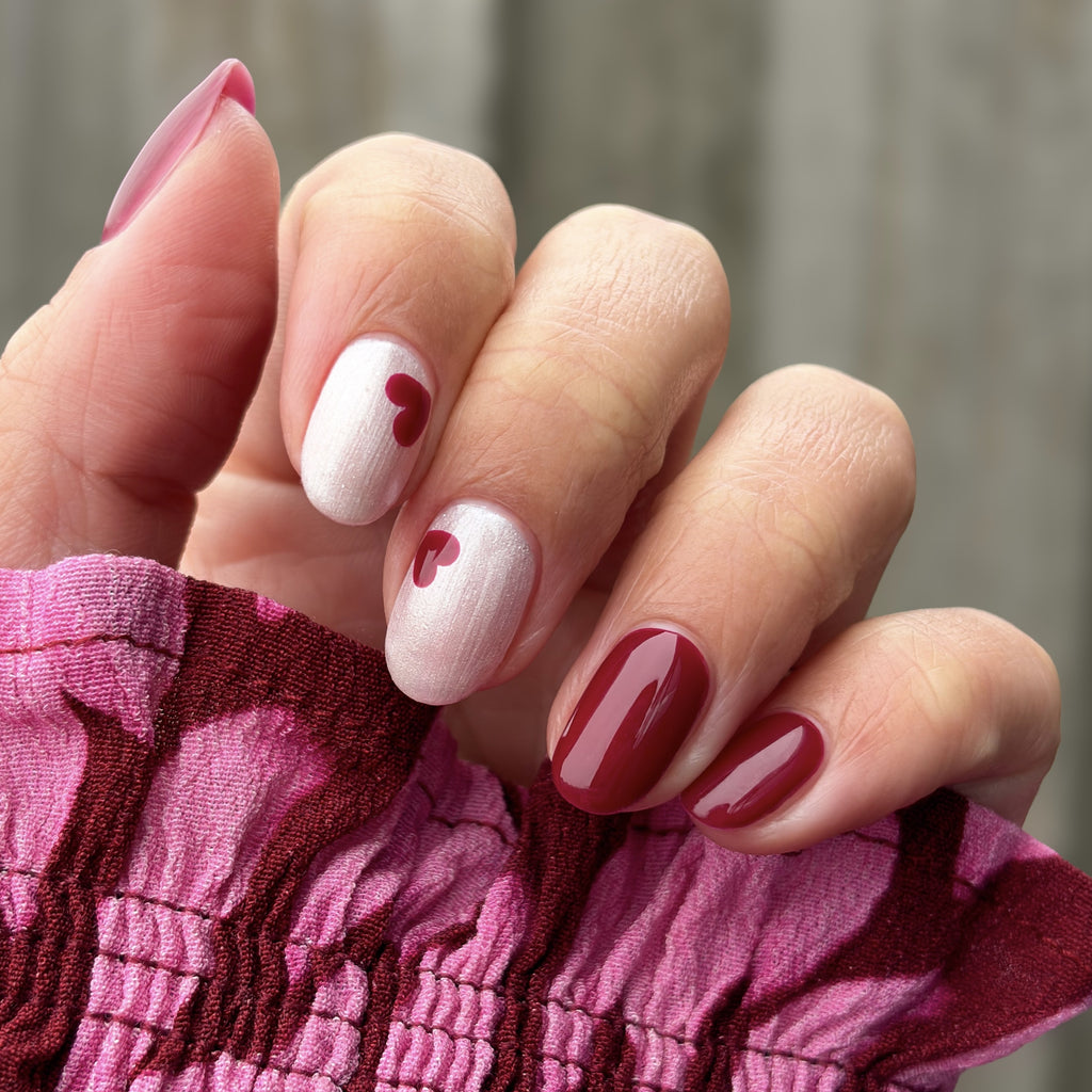 Manicured nails painted with Pink Gellac 491 Cherry Carat gel polish.