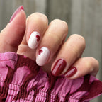 Manicured nails painted with Pink Gellac 491 Cherry Carat gel polish.