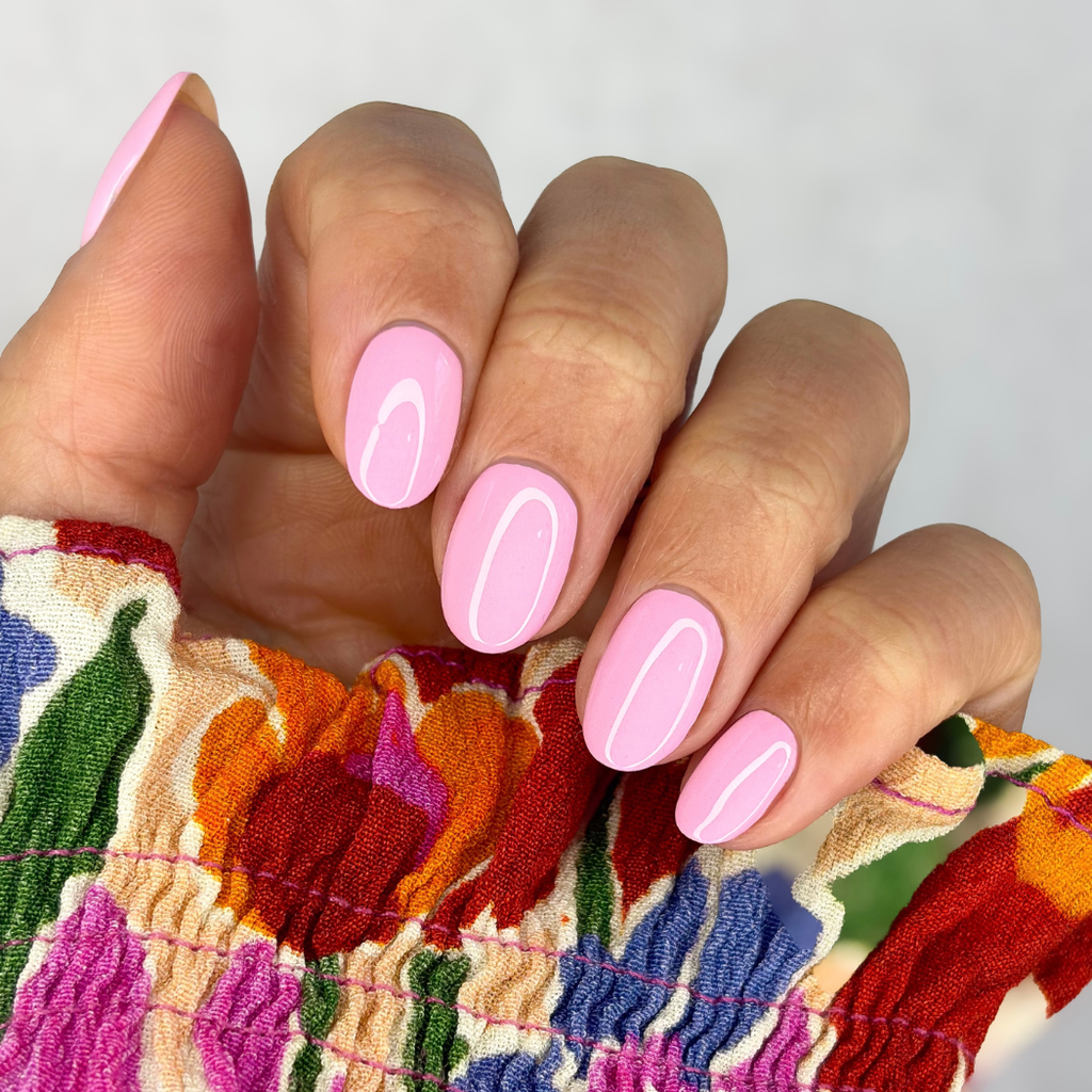 Manicured nails painted with Pink Gellac 486 Sugarcloud Pink gel polish.