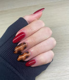 Hand with manicured nails wearing Pink Gellac 199 Luscious Red gel polish.