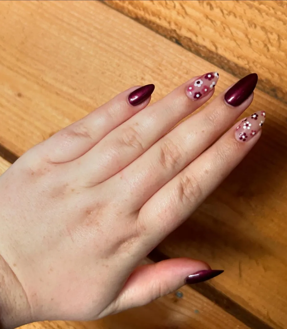 Hand with manicured nails wearing Pink Gellac 205 Burgundy Red gel polish.