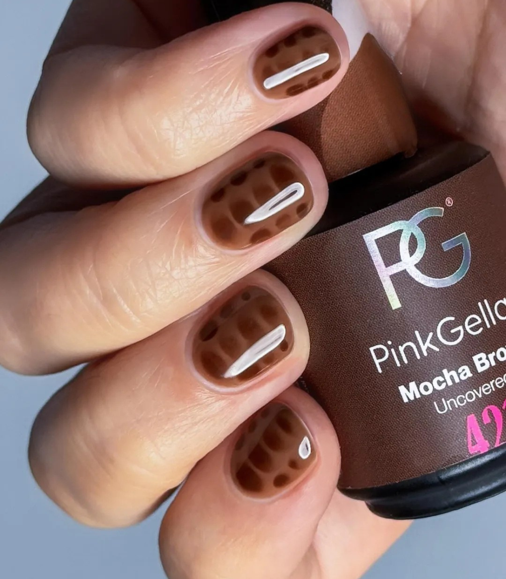Hand with manicured nails wearing Pink Gellac 259 Hazelnut Brown gel polish.
