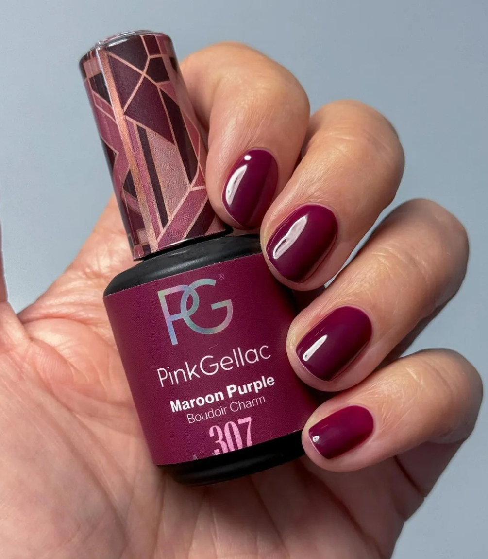 Hand with manicured nails wearing Pink Gellac 307 Maroon Purple gel polish.