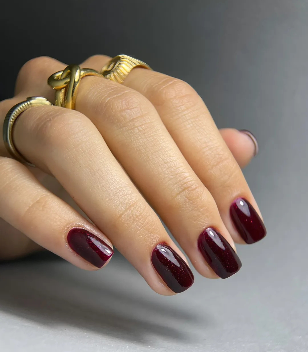 Hand with manicured nails wearing Pink Gellac 308 Dramatic Red gel polish.