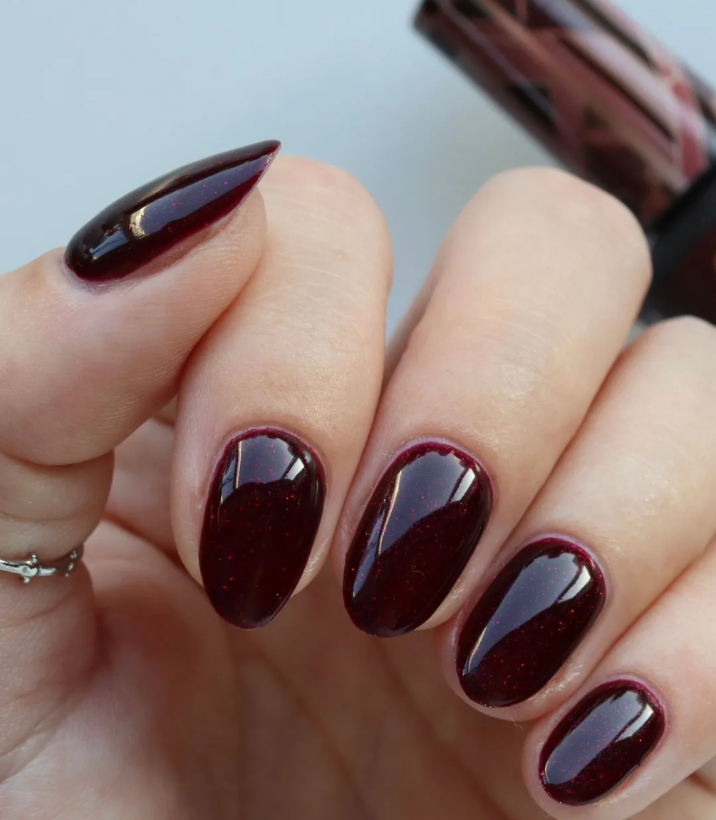 Hand with manicured nails wearing Pink Gellac 308 Dramatic Red gel polish.