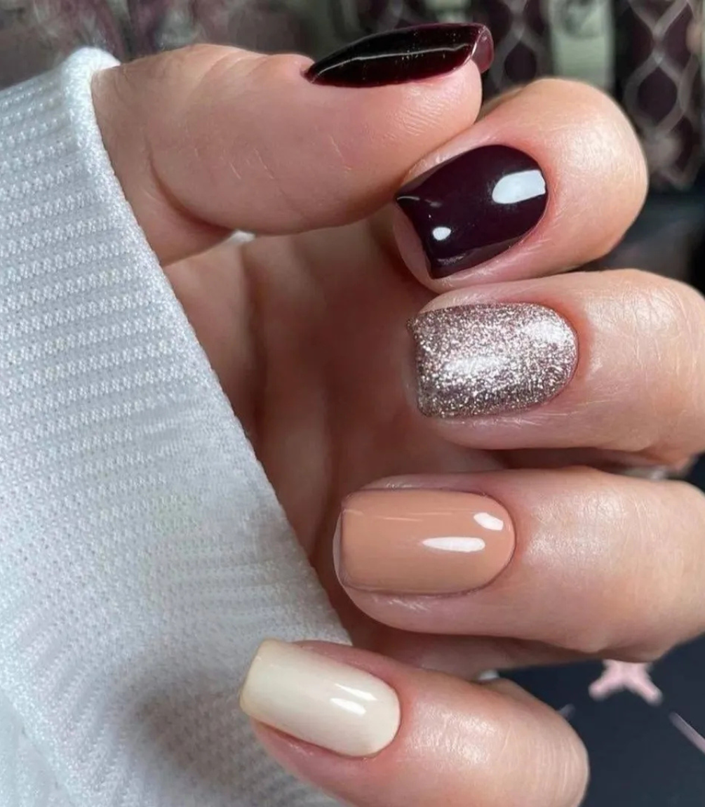 Hand with manicured nails wearing Pink Gellac 332 Sangria Red gel polish.