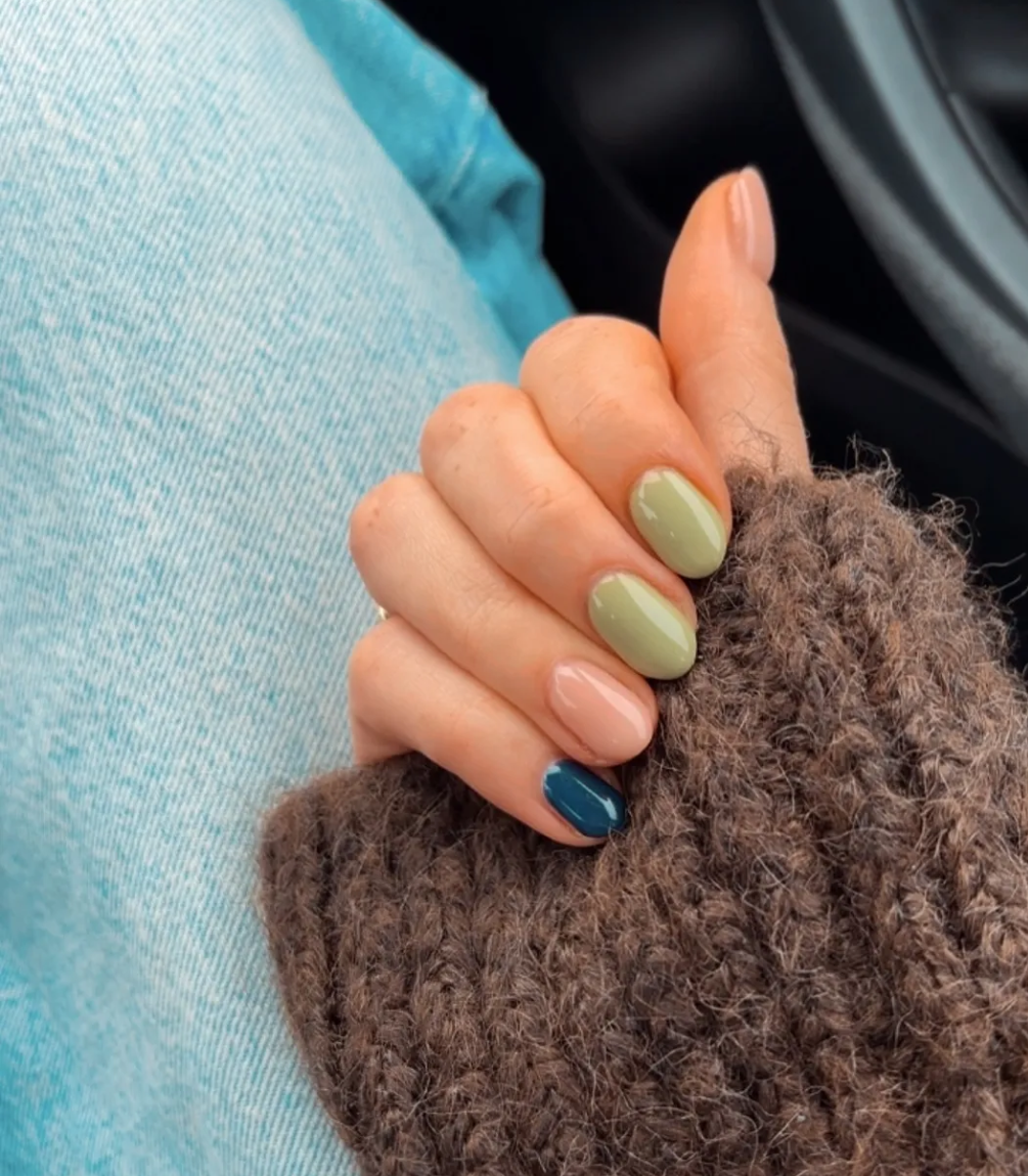 Hand with manicured nails wearing Pink Gellac 338 Classic Blue gel polish.