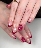 Hand with manicured nails wearing Pink Gellac 355 Royal Red gel polish.