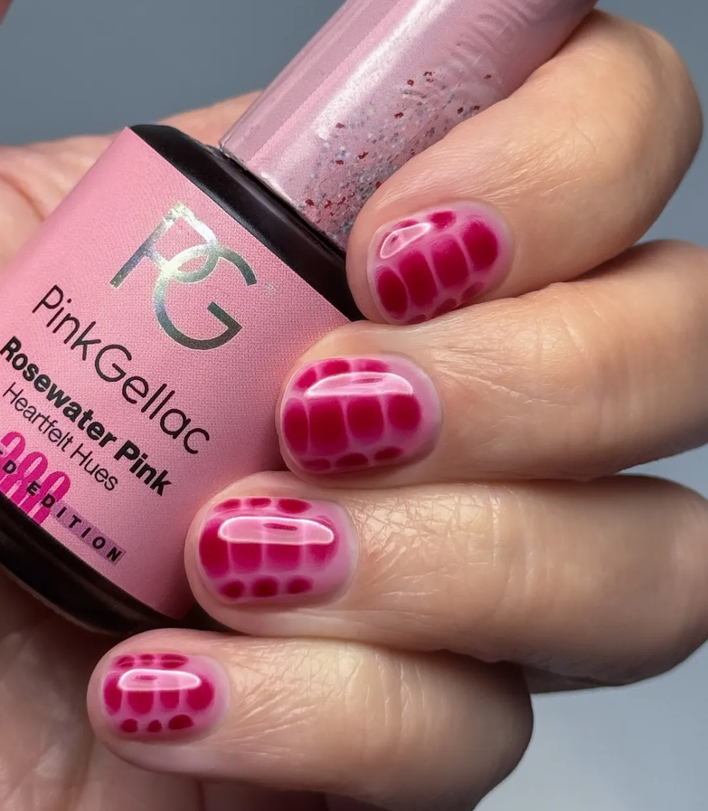 Hand with manicured nails wearing Pink Gellac 388 Rosewater Pink gel polish.