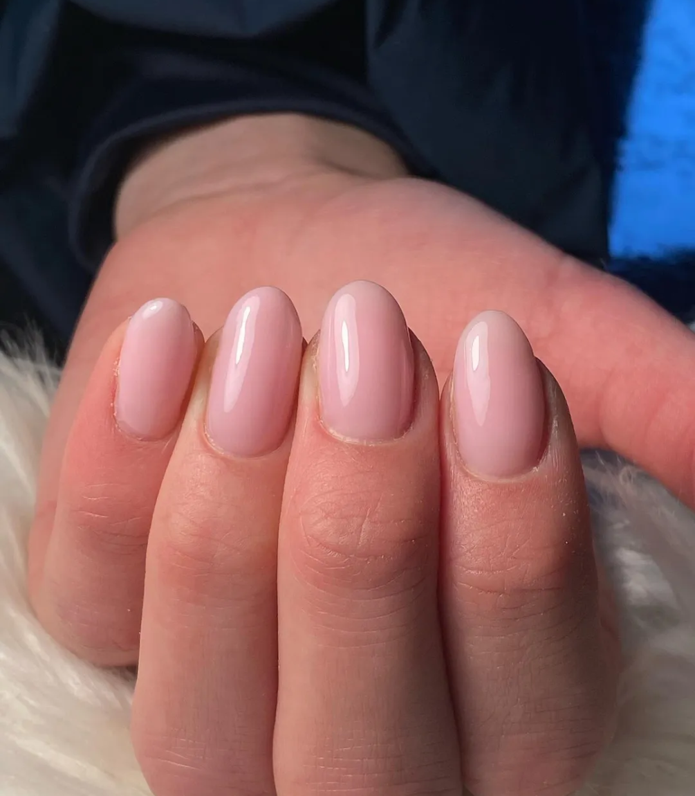 Hand with manicured nails wearing Pink Gellac 388 Rosewater Pink gel polish.