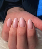 Hand with manicured nails wearing Pink Gellac 388 Rosewater Pink gel polish.