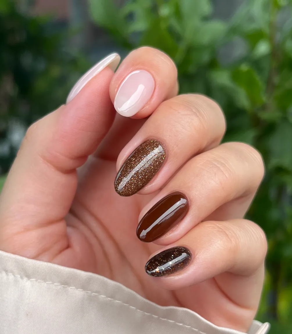 Hand with manicured nails wearing Pink Gellac 420 Sugared Cinnamon gel polish.