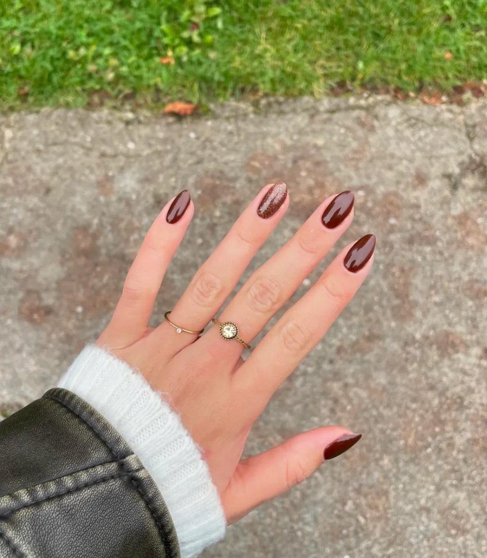 Hand with manicured nails wearing Pink Gellac 420 Sugared Cinnamon gel polish.