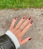 Hand with manicured nails wearing Pink Gellac 421 Mocha Brown gel polish.