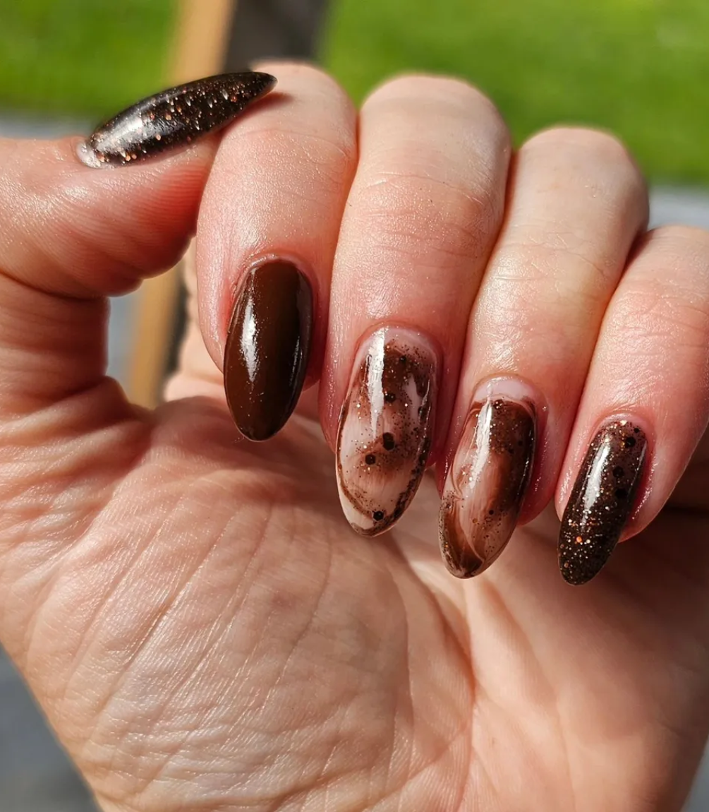 Hand with manicured nails wearing Pink Gellac 422 Espresso Bean gel polish.