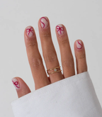 Hand with manicured nails wearing Pink Gellac 439 Berry Sheen gel polish.