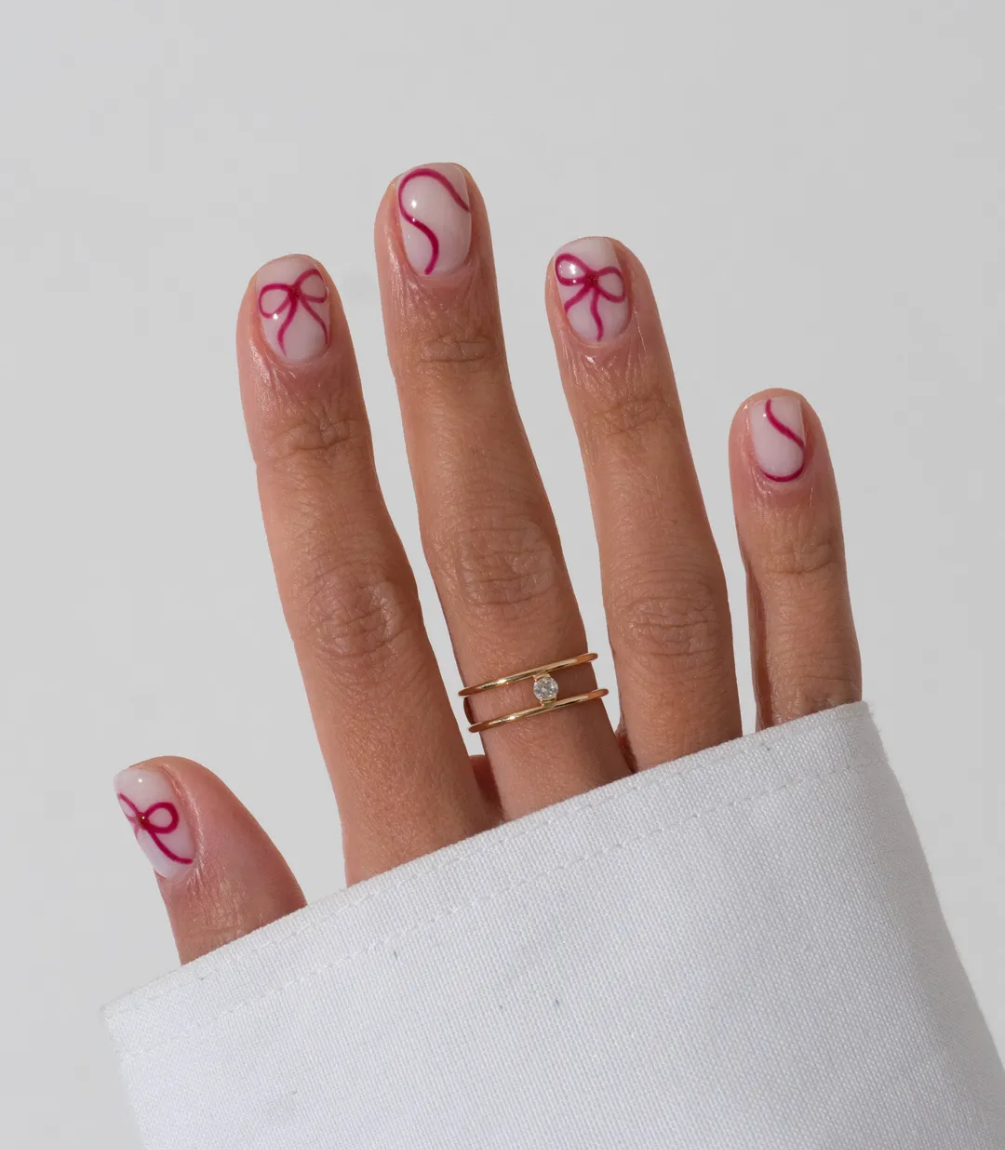 Hand with manicured nails wearing Pink Gellac 439 Berry Sheen gel polish.