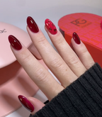 Hand with manicured nails wearing Pink Gellac 439 Berry Sheen gel polish.