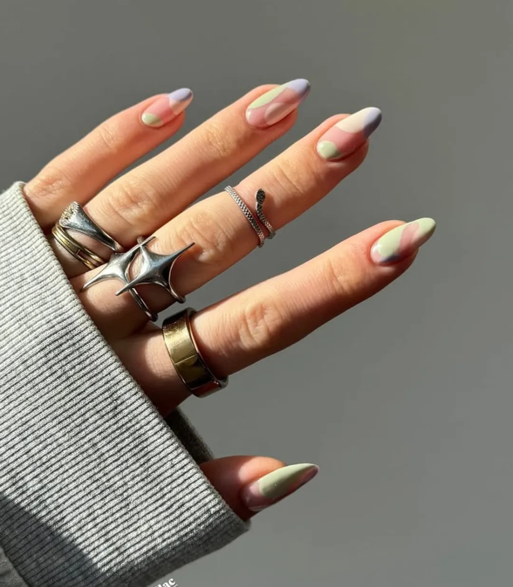 Hand with manicured nails wearing Pink Gellac 445 Butter Yellow gel polish.