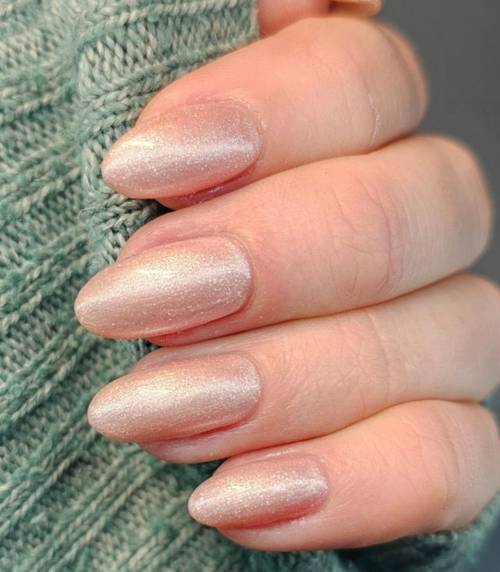 Manicured nails painted with Pink Gellac 472 Oyster Spark gel polish.