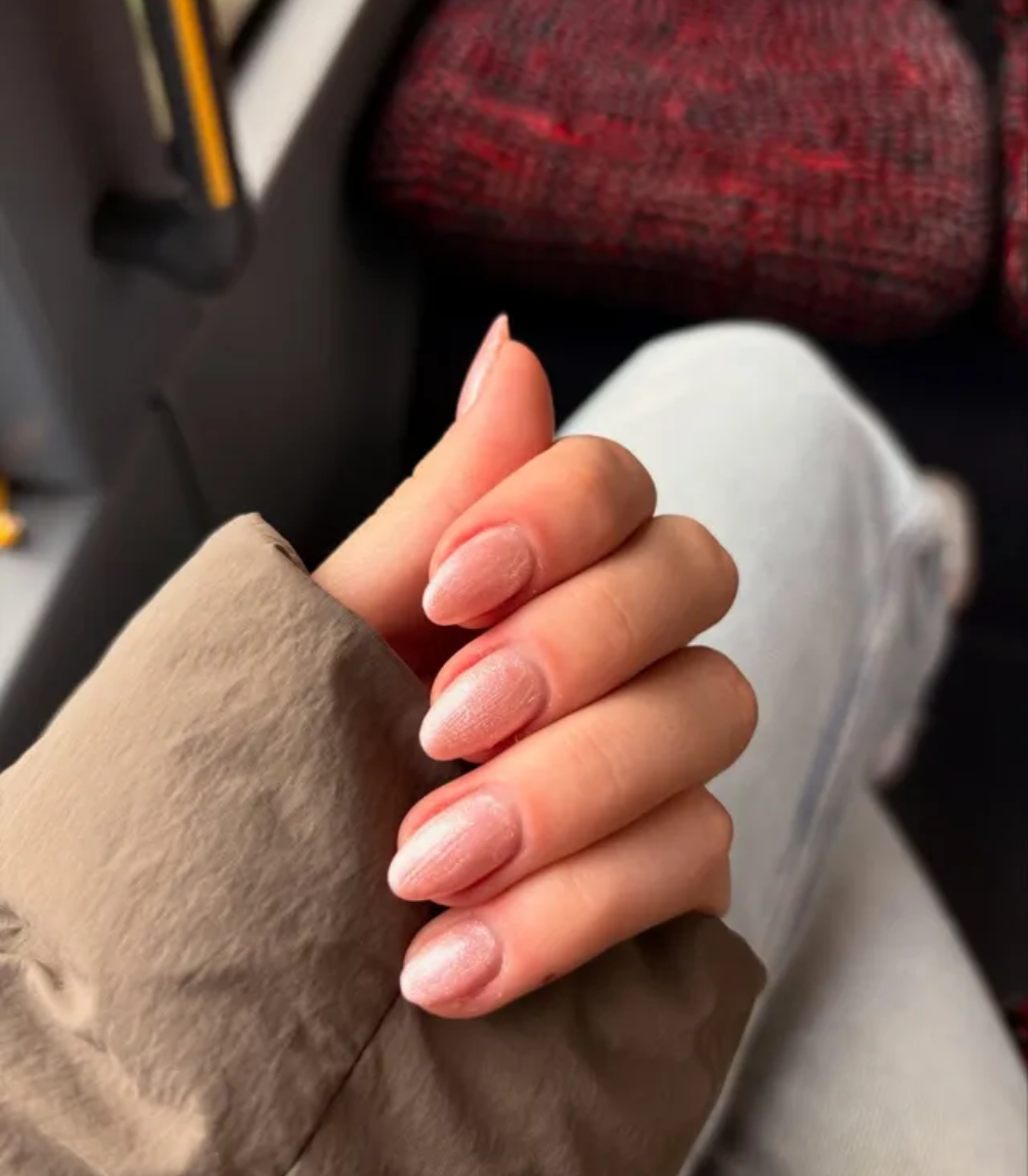 Manicured nails painted with Pink Gellac 472 Oyster Spark gel polish.