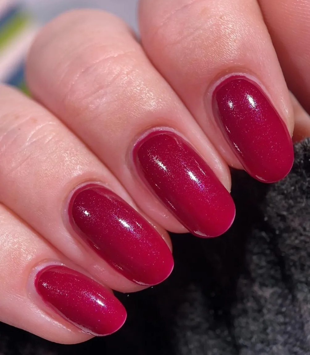 Manicured nails painted with Pink Gellac 473 Candied Cherry gel polish.