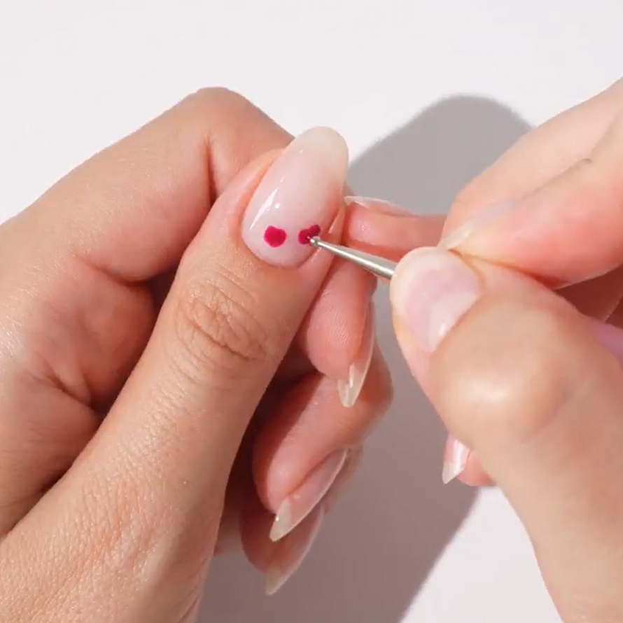 Step 2: Create two dots on your nail