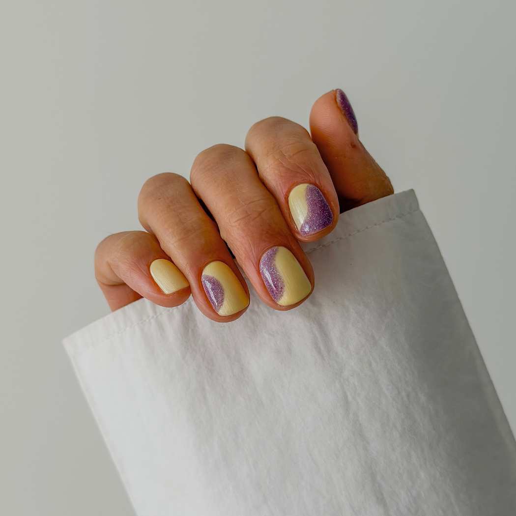 Manicured nails painted with Pink Gellac 487 Yummy Yellow gel polish.