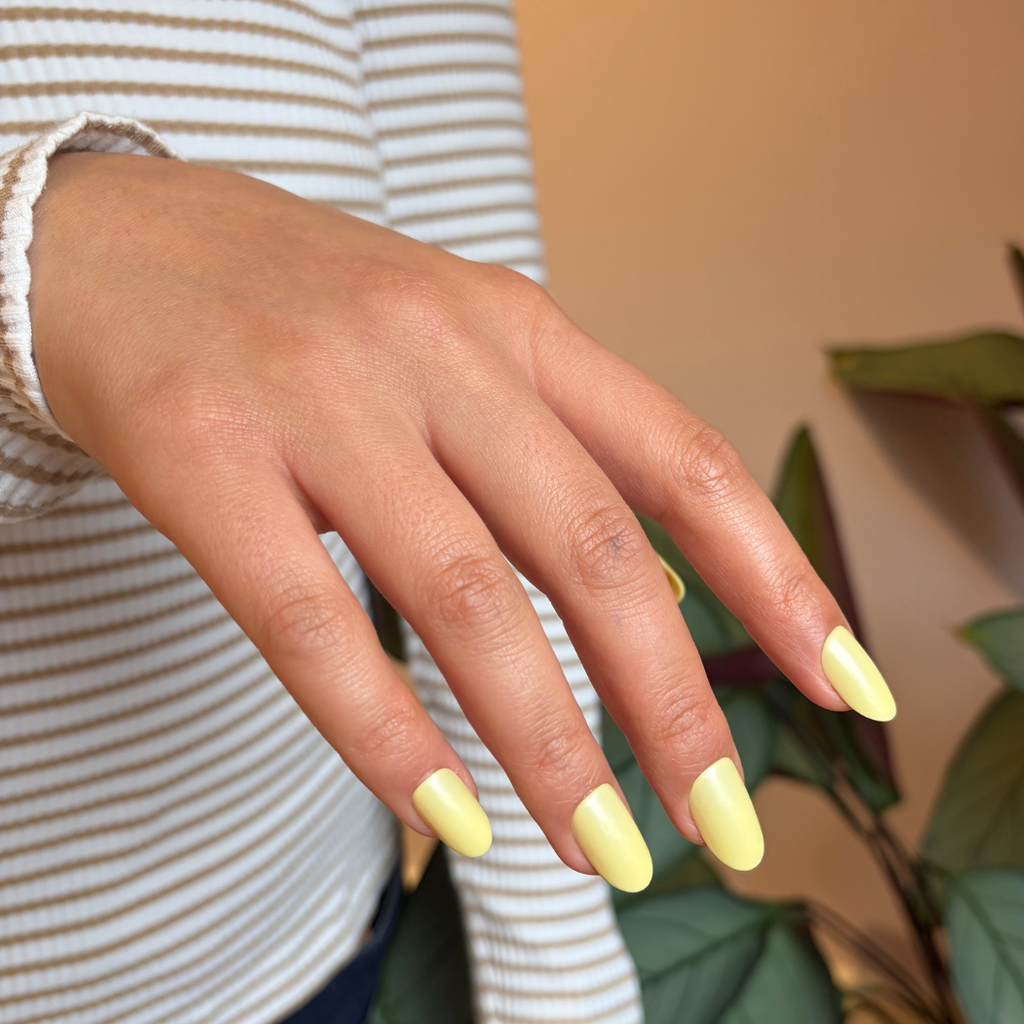 Close-up of Pink Gellac 487 Yummy Yellow press-on nails.