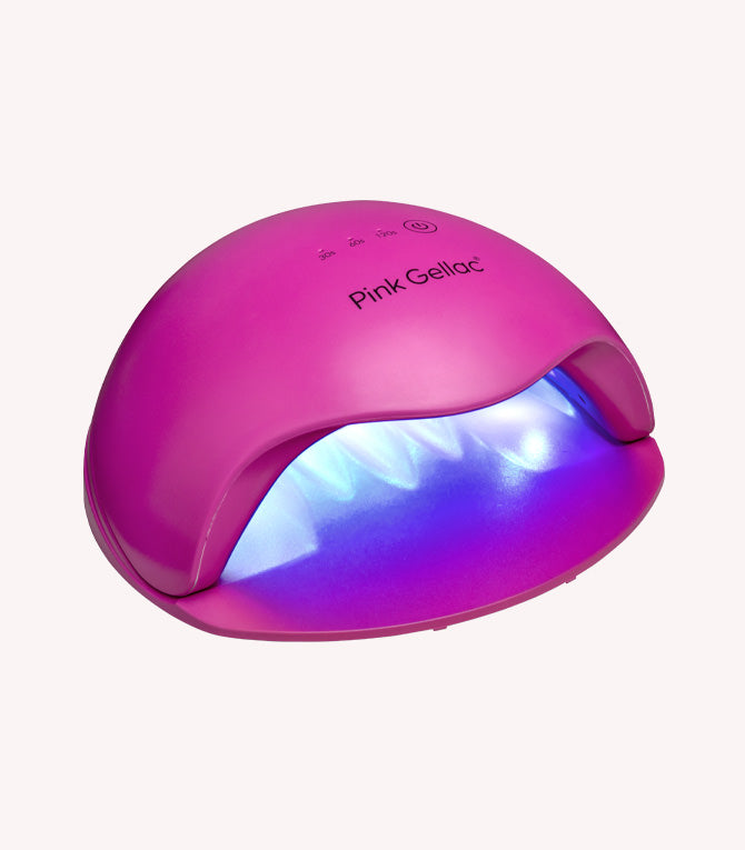 Pink LED lamp for curing gel polish with brand name "Pink Gellac" on it.