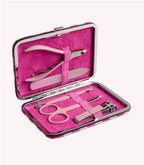 Pink manicure and pedicure set in a case, with pliers, nail file, scissors, tweezers and nail clippers.
