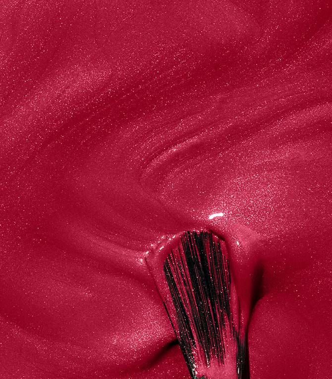 Smear of Pink Gellac 104 Passion Pink gel polish with a brush, showing the vibrant pink shade.