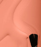 Close-up of Pink Gellac 106 Nude Orange gel polish texture.