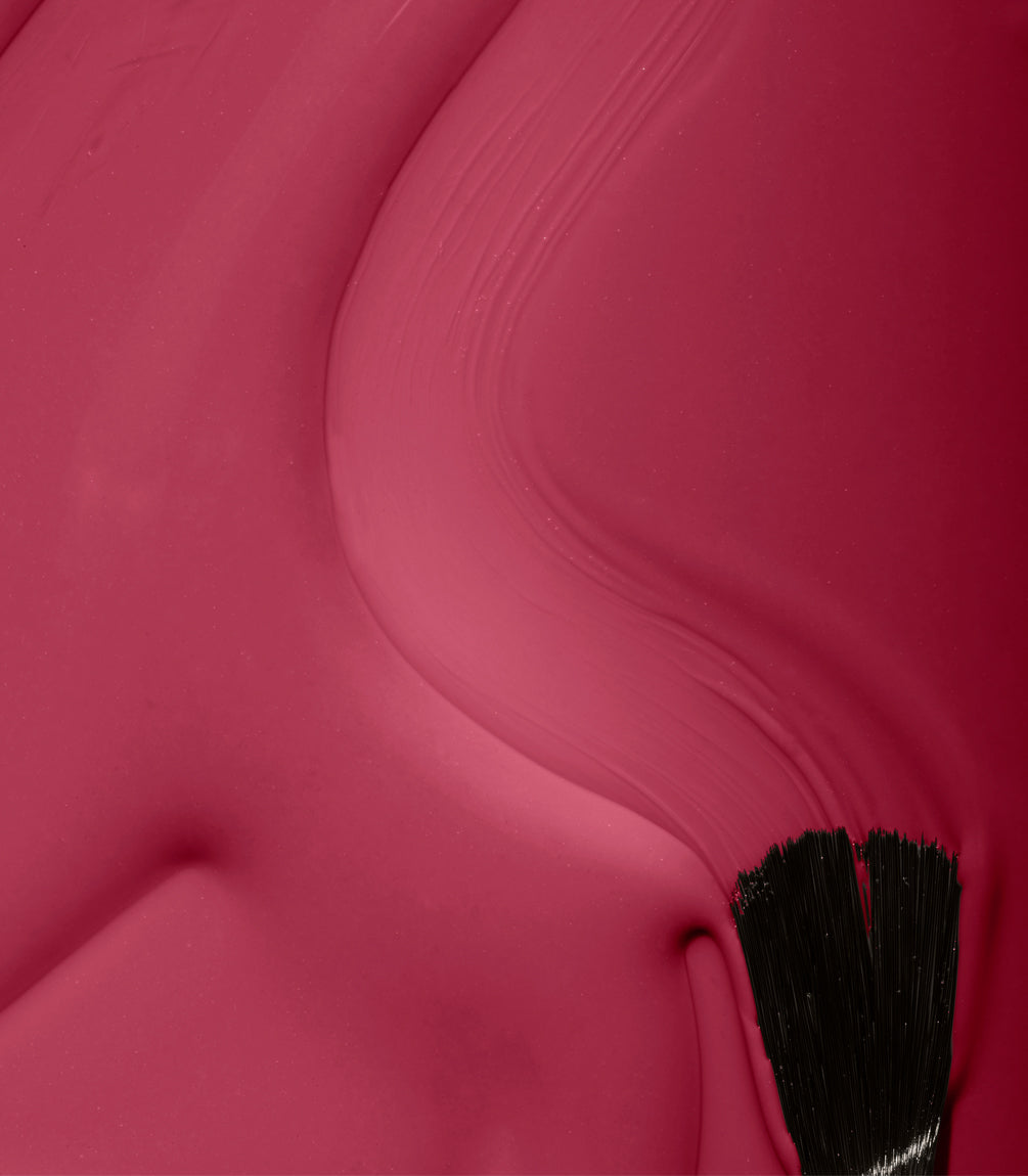 Close-up of Pink Gellac 229 Berry Red gel polish texture.