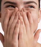 Close-up of a woman with Pink Gellac 330 Caramel Beige manicured nails near her face.