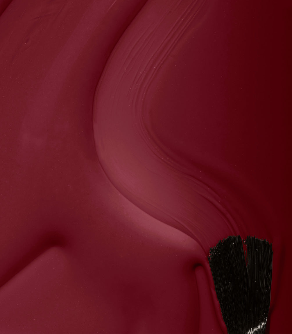 Close-up of Pink Gellac 334 Pomegranate Red gel polish texture.