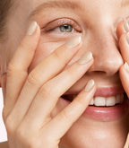 Close-up of a woman with Pink Gellac 401 Marzipan Beige manicured nails near her face.