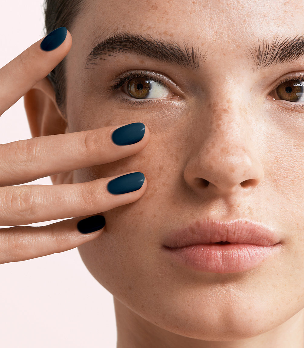 Manicured nails painted with Pink Gellac 470 Midnight Shadow gel polish.