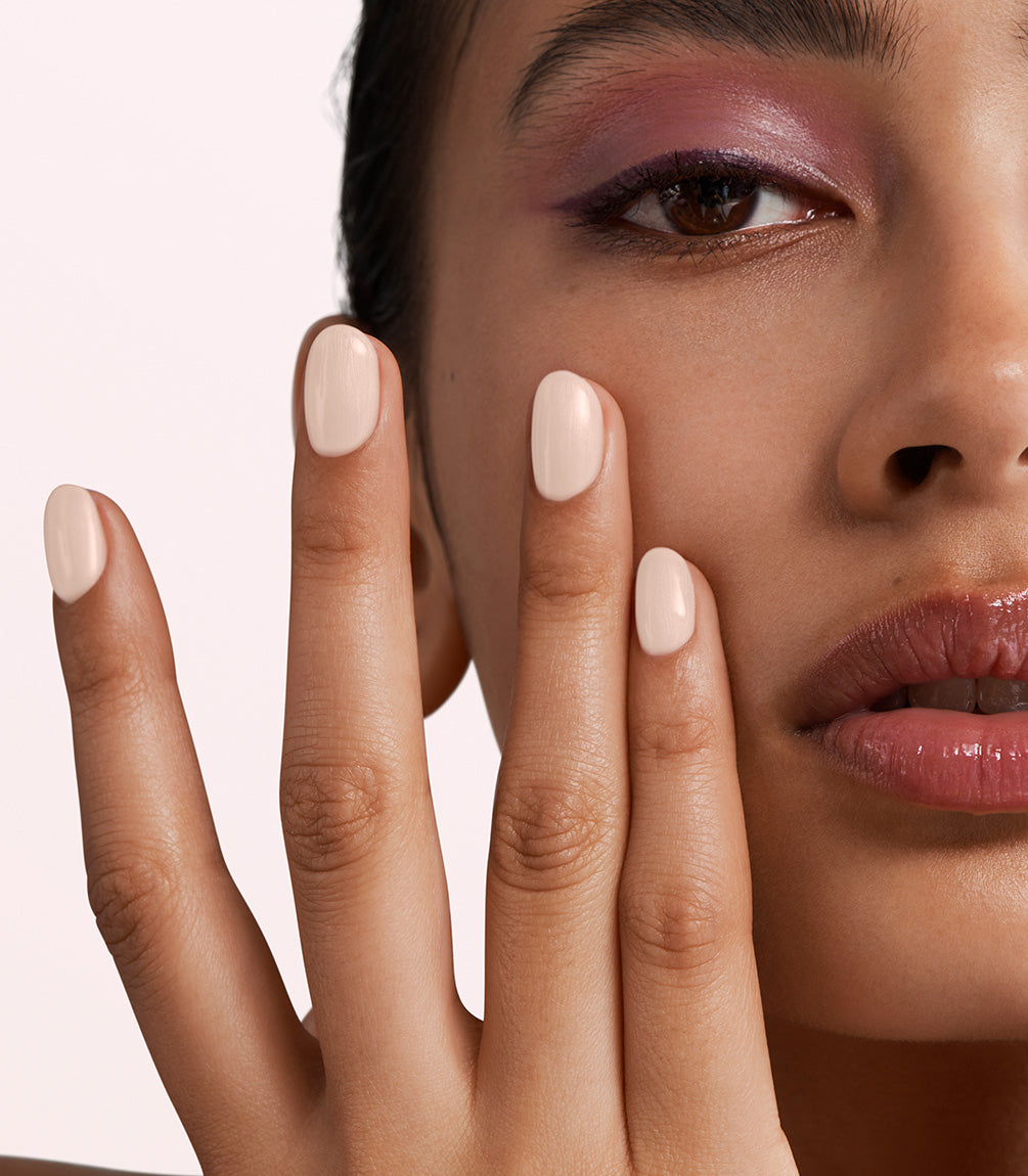 Manicured nails painted with Pink Gellac 472 Oyster Spark gel polish.