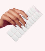 Hand wearing Pink Gellac 001 Whispering White gel nail stickers.
